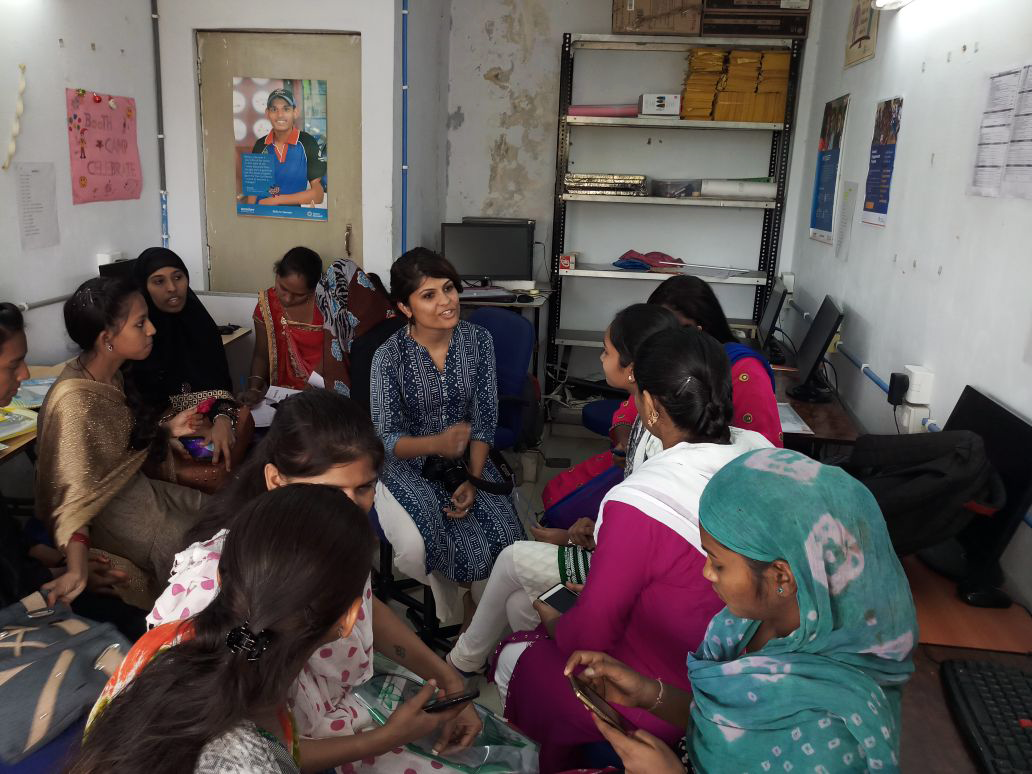 Prachi speaking with students and alumni at a centre in Ahmedabad