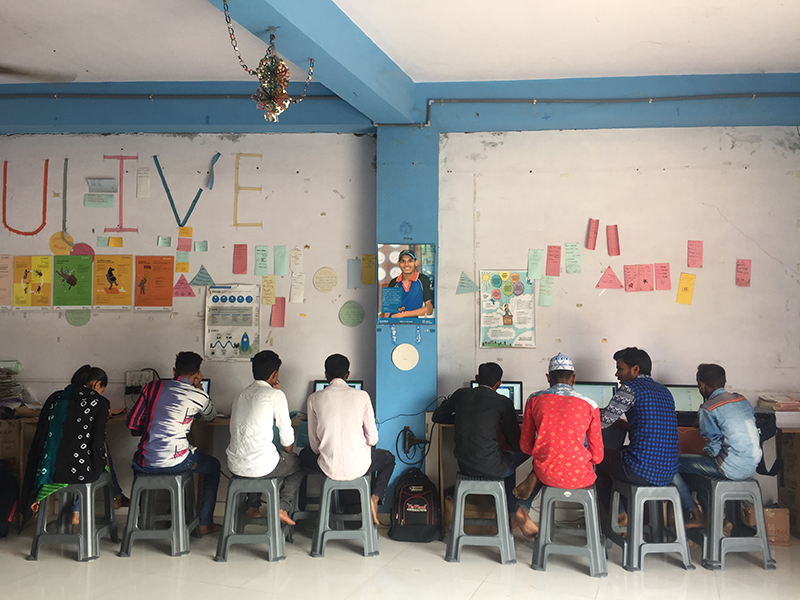 Learners at a center in peri-urban Gujarat going through lessons in teams